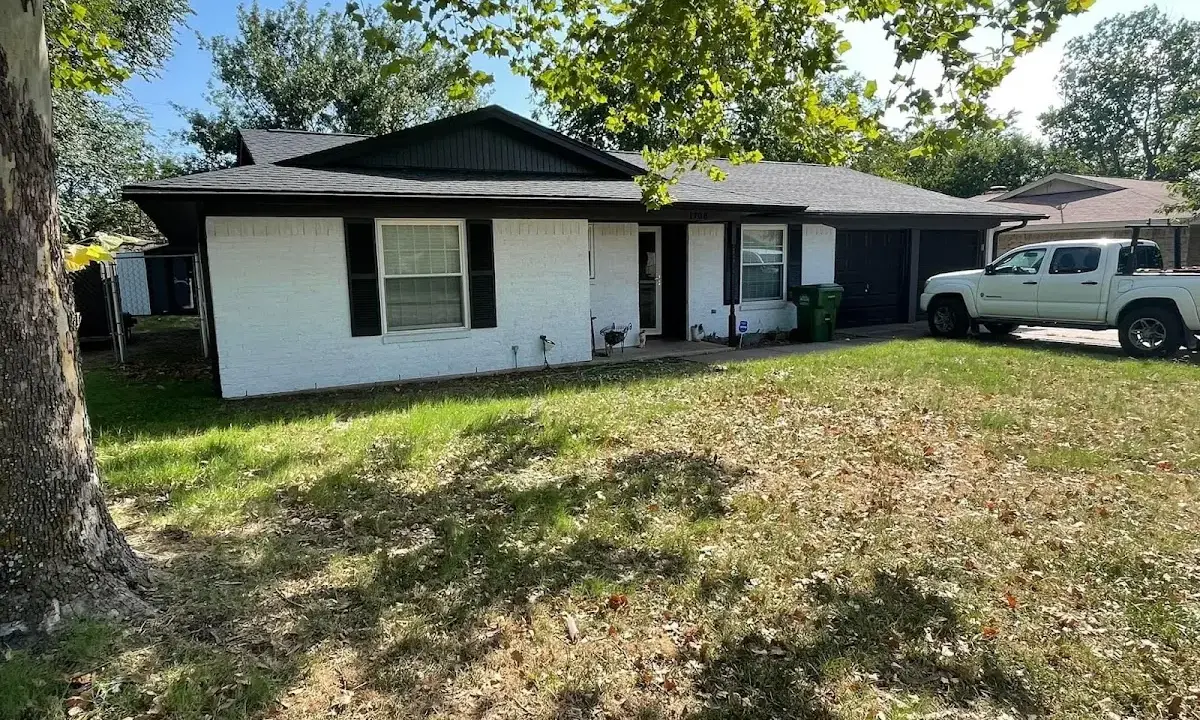 Professional roofing crew working on a residential roof in Brook Park